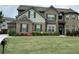 Beautiful brick and siding two-story home with a well-manicured lawn and landscaping at 4030 Amberhill Cir, Cumming, GA 30040