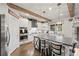 Well-equipped kitchen featuring stainless steel appliances, island seating and modern lighting at 4030 Amberhill Cir, Cumming, GA 30040
