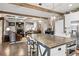Open concept kitchen featuring island with seating, stainless steel appliances and hardwood floors at 4030 Amberhill Cir, Cumming, GA 30040