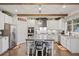 Bright, modern kitchen with white cabinets, granite countertops, and stainless steel appliances at 4030 Amberhill Cir, Cumming, GA 30040