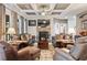Spacious living room with stone fireplace, coffered ceilings and stylish decor at 4030 Amberhill Cir, Cumming, GA 30040