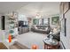 Large entertainment room with a sofa, TV, sports memorabilia, and neutral carpeting at 4030 Amberhill Cir, Cumming, GA 30040