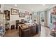 Inviting home office featuring hardwood floors, a large desk, and ample storage and display space at 4030 Amberhill Cir, Cumming, GA 30040