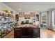 Spacious office with custom cabinetry, a large desk, hardwood floors, and natural light at 4030 Amberhill Cir, Cumming, GA 30040