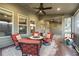 Patio with outdoor seating area, ceiling fans, and views of the backyard at 4030 Amberhill Cir, Cumming, GA 30040