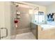 Luxurious bathroom featuring a glass-enclosed shower and separate soaking tub at 4030 Amberhill Cir, Cumming, GA 30040