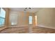 Serene bedroom with neutral tones, natural light, and wood-look floors creates a cozy retreat at 5905 Brookside Oak Cir, Norcross, GA 30093