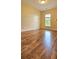 Bright bedroom with hardwood floors, natural light, and a ceiling fan for added comfort at 5905 Brookside Oak Cir, Norcross, GA 30093
