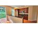 Bright kitchen boasts stainless appliances, wood floors, and a deck with wooded view at 5905 Brookside Oak Cir, Norcross, GA 30093