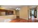 Open kitchen includes stainless appliances, dark wood cabinets, and flows into the living area at 5905 Brookside Oak Cir, Norcross, GA 30093