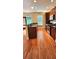 Well-lit kitchen features dark wood cabinets, stainless appliances, and granite counters at 5905 Brookside Oak Cir, Norcross, GA 30093