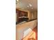 Spacious kitchen features granite counters, stainless appliances, and dark wood cabinets at 5905 Brookside Oak Cir, Norcross, GA 30093