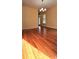 Bright living room with hardwood floors and a modern chandelier, perfect for entertaining at 5905 Brookside Oak Cir, Norcross, GA 30093