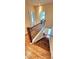 Hallway with hardwood staircase and black metal railings at 5905 Brookside Oak Cir, Norcross, GA 30093