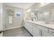 Bright bathroom with a double vanity, sleek cabinets, and a large mirror, offering a spa-like experience at 1165 Millennium Park Rd, Decatur, GA 30033