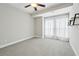 Bedroom features neutral colored walls, carpet flooring and bright natural light at 1165 Millennium Park Rd, Decatur, GA 30033
