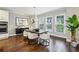 Bright dining area featuring hardwood floors, modern lighting, and large windows, perfect for Gathering meals at 1165 Millennium Park Rd, Decatur, GA 30033