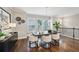 Bright dining room featuring a modern table, designer chairs, and a stylish light fixture at 1165 Millennium Park Rd, Decatur, GA 30033