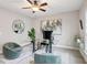 Comfortable home office with contemporary decor, ample natural light, and a stylish glass desk at 1165 Millennium Park Rd, Decatur, GA 30033