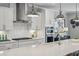 Well-appointed kitchen with stainless steel appliances, tiled backsplash, and bright pendant lighting at 1165 Millennium Park Rd, Decatur, GA 30033
