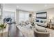 Bright living room featuring hardwood floors, a modern rug, and comfortable seating at 1165 Millennium Park Rd, Decatur, GA 30033