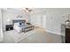 Spacious bedroom features tray ceiling, ceiling fan, and carpet floors at 1165 Millennium Park Rd, Decatur, GA 30033