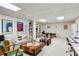 Cozy basement with a couch, books, workout machine, and decor at 12 Braemore Dr, Atlanta, GA 30328