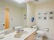 Light and airy bathroom with a large mirror over a vanity and a toilet at 12 Braemore Dr, Atlanta, GA 30328