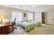 Bright bedroom with two twin beds, a desk area, and ample closet space at 12 Braemore Dr, Atlanta, GA 30328