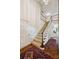 Grand foyer featuring a staircase, hardwood floors, and elegant details, creating a welcoming entrance at 12 Braemore Dr, Atlanta, GA 30328