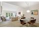 Bright living room with high ceilings, large windows, and stylish furnishings, perfect for entertaining at 12 Braemore Dr, Atlanta, GA 30328