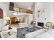 Open-concept living area with soaring ceilings, a fireplace, and elegant decor, ideal for modern living at 12 Braemore Dr, Atlanta, GA 30328