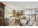 Inviting loft area with a cozy sofa, built-in bookshelves, and decorative accents at 12 Braemore Dr, Atlanta, GA 30328