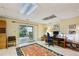 Bright office with large desk, sliding glass doors to patio, and colorful rug at 12 Braemore Dr, Atlanta, GA 30328