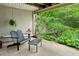 Patio with adirondack chairs and outdoor furniture in front of lush landscaping at 12 Braemore Dr, Atlanta, GA 30328