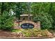 Stone sign welcomes you to Wynne's Ridge with colorful flowers in the foreground at 1501 Wynnes Ridge Cir, Marietta, GA 30067