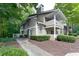 Attractive two-story home featuring two private balconies and lush landscaping at 1501 Wynnes Ridge Cir, Marietta, GA 30067