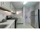 Efficient kitchen layout with modern appliances and convenient access to other rooms at 1501 Wynnes Ridge Cir, Marietta, GA 30067