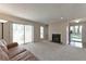 Inviting living room with neutral tones, a cozy fireplace, and access to a private patio at 1501 Wynnes Ridge Cir, Marietta, GA 30067