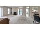 Spacious open-plan living area with fireplace, neutral carpet and walls, and a view of the front door at 1501 Wynnes Ridge Cir, Marietta, GA 30067