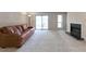Bright living area with a cozy fireplace and sliding glass doors to the outside at 1501 Wynnes Ridge Cir, Marietta, GA 30067