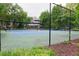 Enjoy a match on the community's outdoor tennis court surrounded by mature trees at 1501 Wynnes Ridge Cir, Marietta, GA 30067