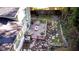 Virtually staged backyard with a wood deck, patio furniture, foliage, and stone patio at 2020 Kenwood Se Pl, Smyrna, GA 30082