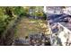 Backyard with a grass lawn, foliage, and brick steps at 2020 Kenwood Se Pl, Smyrna, GA 30082