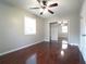 Bedroom features ceiling fan, walk-in closet, and wood floors at 2020 Kenwood Se Pl, Smyrna, GA 30082