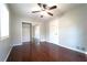 Bedroom features ceiling fan, walk-in closet, and wood floors at 2020 Kenwood Se Pl, Smyrna, GA 30082