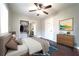 Staged bedroom features ceiling fan, walk-in closet, and wood floors at 2020 Kenwood Se Pl, Smyrna, GA 30082