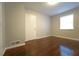 Bedroom featuring wood floors, a window providing natural light, and a closet door at 2020 Kenwood Se Pl, Smyrna, GA 30082