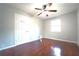 Bedroom has a ceiling fan and wood floors at 2020 Kenwood Se Pl, Smyrna, GA 30082