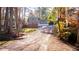 Exterior view of home featuring lush trees at 2020 Kenwood Se Pl, Smyrna, GA 30082